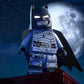 LEGO Batman figure on a rooftop with a full moon in the background